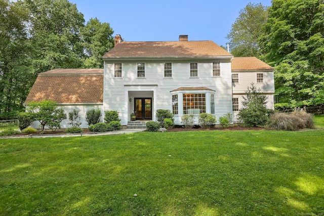 30 Norfield Woods Rd, Weston, CT 06883 - colonial house featuring french doors, a front lawn, and a chimney