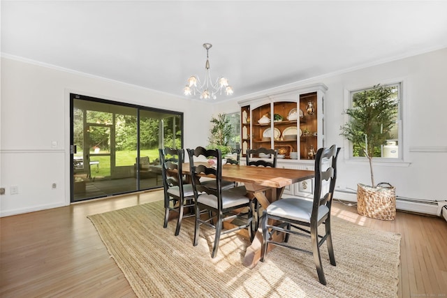 30 Norfield Woods Rd, Weston, CT 06883 - dining room featuring a chandelier, healthy amount of natural light, ornamental molding, and wood finished floors