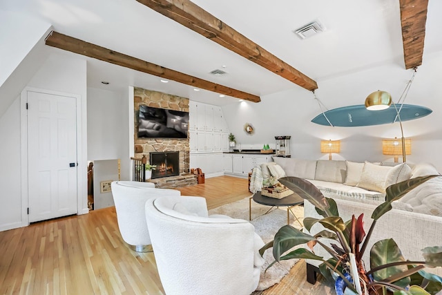 30 Norfield Woods Rd, Weston, CT 06883 - living area featuring light wood-style floors, beamed ceiling, and a fireplace