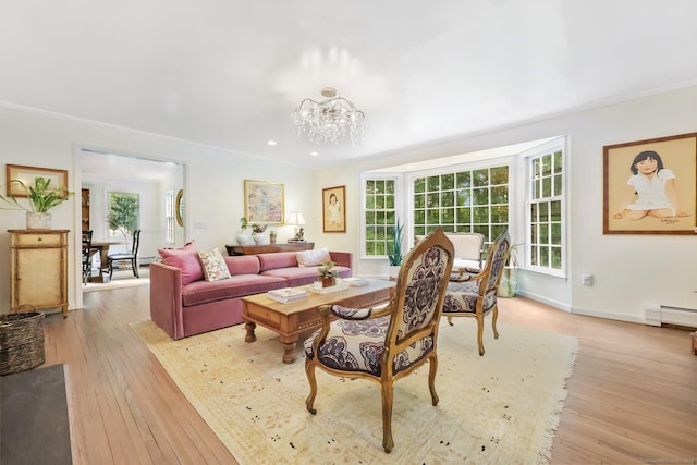 30 Norfield Woods Rd, Weston, CT 06883 - living room featuring light wood finished floors, a chandelier, a baseboard radiator, crown molding, and baseboards
