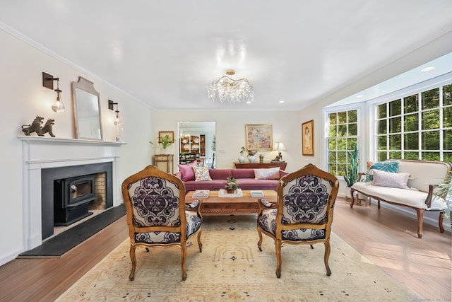 30 Norfield Woods Rd, Weston, CT 06883 - living area featuring crown molding, wood finished floors, a chandelier, a wood stove, and baseboards