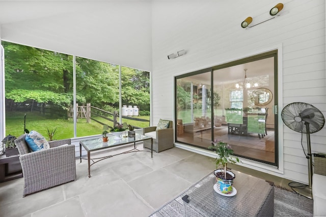 30 Norfield Woods Rd, Weston, CT 06883 - sunroom with an outdoor hangout area and a chandelier