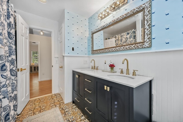 30 Norfield Woods Rd, Weston, CT 06883 - bathroom featuring double vanity, wainscoting, and tile patterned flooring