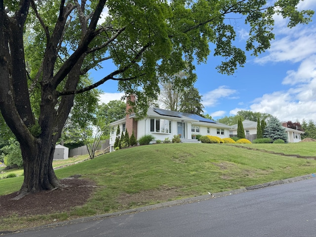 38 Kingston Rd, Trumbull, CT 06611 - ranch-style house featuring a chimney and roof mounted solar panels