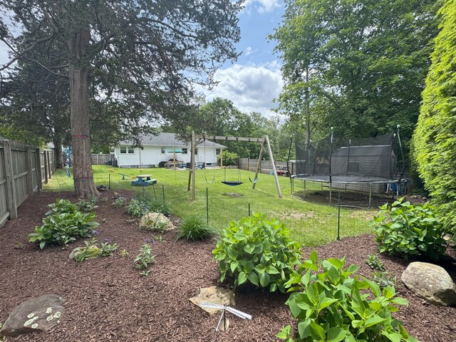 38 Kingston Rd, Trumbull, CT 06611 - fenced backyard featuring a trampoline