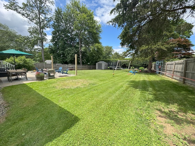 38 Kingston Rd, Trumbull, CT 06611 - fenced backyard with a patio, a shed, and a playground