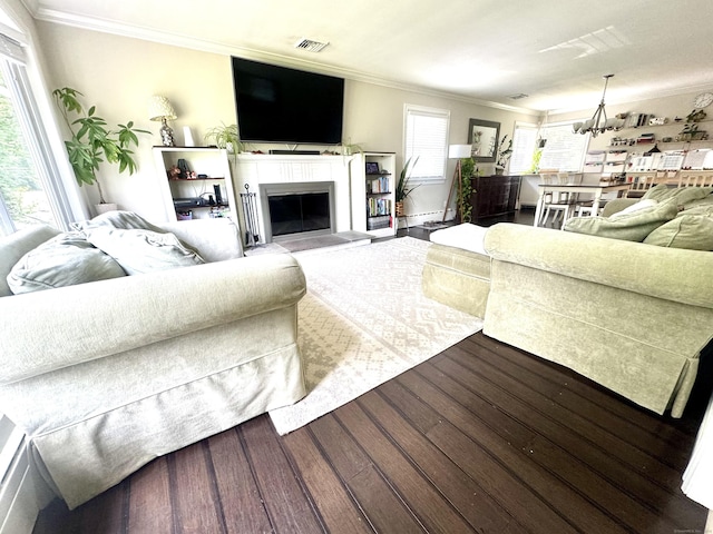 38 Kingston Rd, Trumbull, CT 06611 - living room featuring crown molding, wood finished floors, a glass covered fireplace, and a chandelier