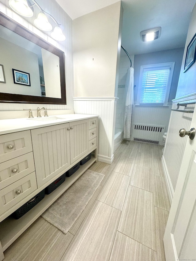38 Kingston Rd, Trumbull, CT 06611 - full bathroom with radiator heating unit, vanity, shower / bathtub combination with curtain, and wainscoting
