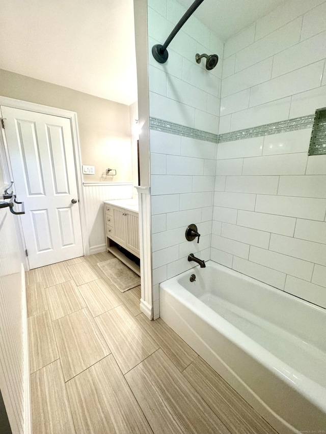38 Kingston Rd, Trumbull, CT 06611 - bathroom featuring bathtub / shower combination, vanity, wood finish floors, and wainscoting