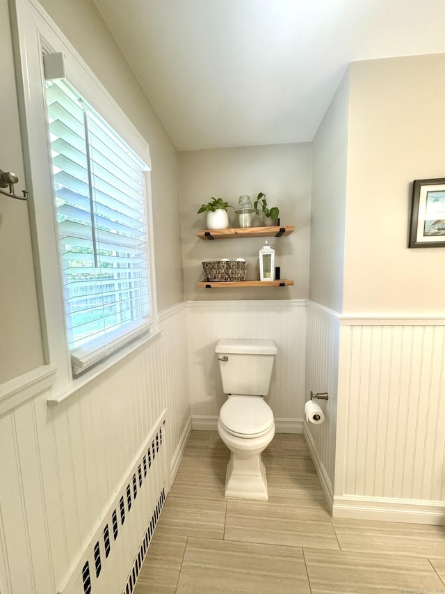 38 Kingston Rd, Trumbull, CT 06611 - bathroom with a wainscoted wall, healthy amount of natural light, and radiator heating unit