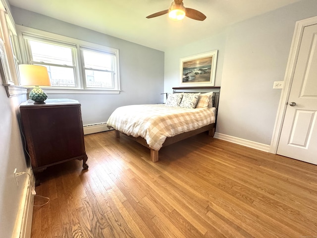 38 Kingston Rd, Trumbull, CT 06611 - bedroom featuring a baseboard heating unit, wood finished floors, and a ceiling fan