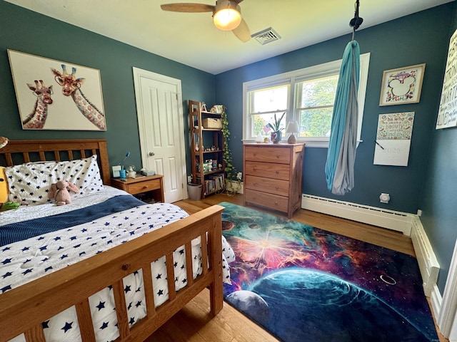 38 Kingston Rd, Trumbull, CT 06611 - bedroom with wood finished floors, a baseboard radiator, and ceiling fan