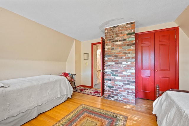 12 Whispering Rod Rd, Farmington, CT 06085 - bedroom featuring wood finished floors, lofted ceiling, and baseboards