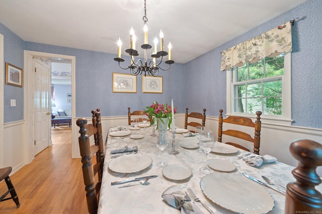 12 Whispering Rod Rd, Farmington, CT 06085 - dining area featuring light wood-style flooring, wainscoting, and a chandelier