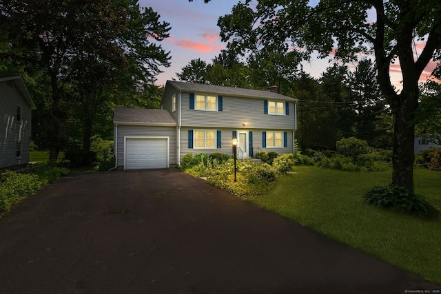 670 Avery St, South Windsor, CT 06074 - colonial inspired home with asphalt driveway, an attached garage, a front yard, and a chimney