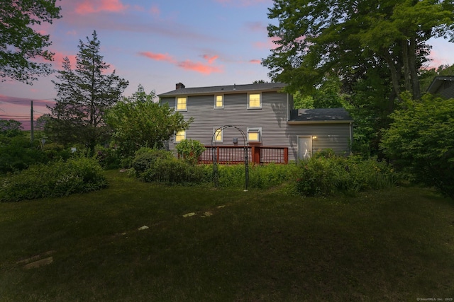 670 Avery St, South Windsor, CT 06074 - back of property with a wooden deck, a yard, and a chimney