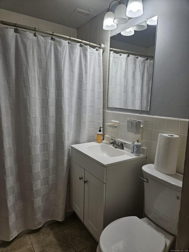 40 Owen St Apt D6, Hartford, CT 06105 - bathroom with toilet, vanity, tile walls, and tile patterned flooring