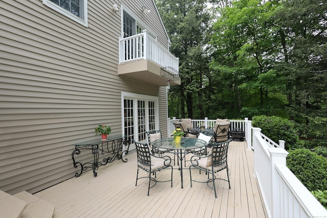 114 Peaceable Ridge Rd, Ridgefield, CT 06877 - deck with outdoor dining space and view of wooded area