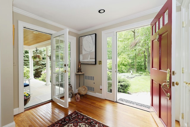 114 Peaceable Ridge Rd, Ridgefield, CT 06877 - foyer with light wood-type flooring, crown molding, and baseboards