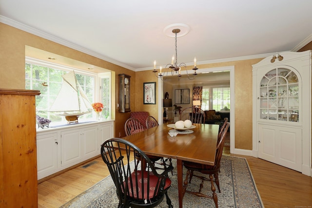114 Peaceable Ridge Rd, Ridgefield, CT 06877 - dining room featuring a chandelier, light wood-type flooring, and crown molding