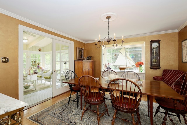 114 Peaceable Ridge Rd, Ridgefield, CT 06877 - dining space featuring a chandelier, light wood-type flooring, and crown molding