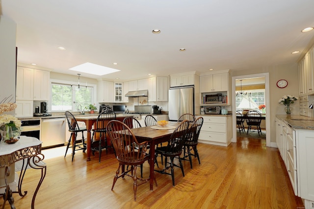 114 Peaceable Ridge Rd, Ridgefield, CT 06877 - dining area featuring a skylight, plenty of natural light, light wood finished floors, and recessed lighting