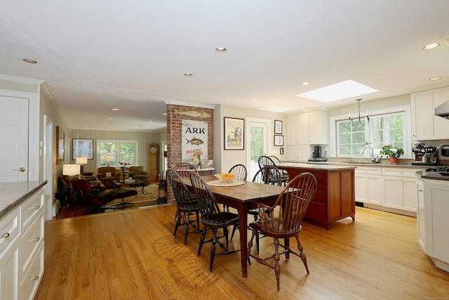 114 Peaceable Ridge Rd, Ridgefield, CT 06877 - dining area with a skylight, healthy amount of natural light, light wood finished floors, recessed lighting, and crown molding