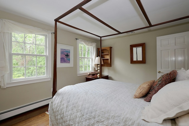 114 Peaceable Ridge Rd, Ridgefield, CT 06877 - bedroom with a baseboard heating unit and wood finished floors