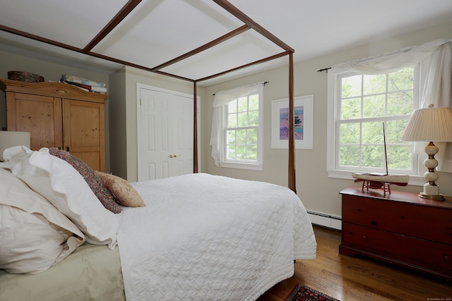 114 Peaceable Ridge Rd, Ridgefield, CT 06877 - bedroom with a baseboard radiator, dark wood finished floors, multiple windows, and a closet