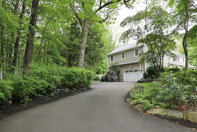 114 Peaceable Ridge Rd, Ridgefield, CT 06877 - view of front of house with driveway and a garage