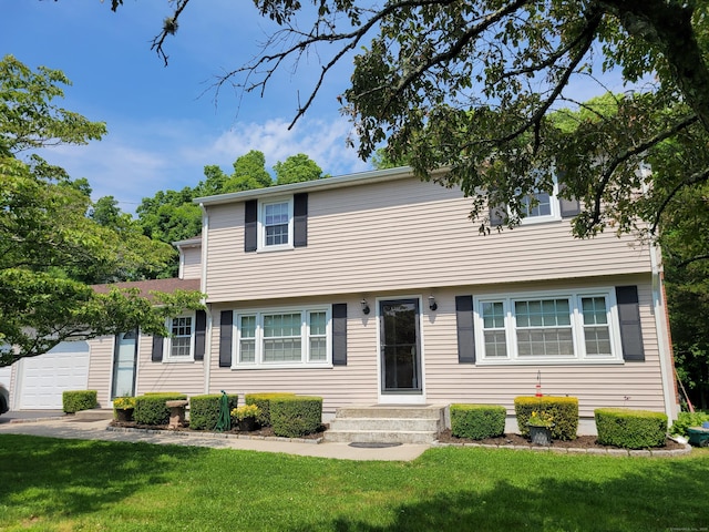 20 Laurel Wood Rd, North Stonington, CT 06359 - colonial house featuring a front yard and an attached garage