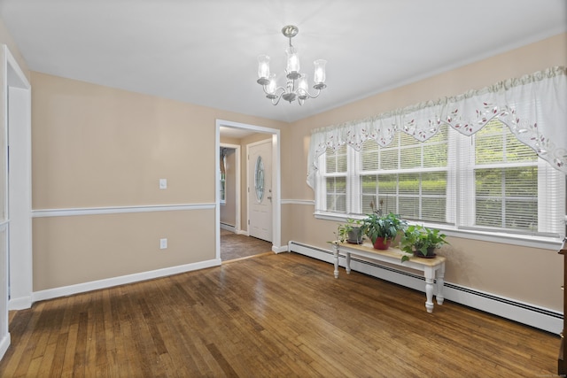 20 Laurel Wood Rd, North Stonington, CT 06359 - dining room with a chandelier, a baseboard radiator, and wood finished floors