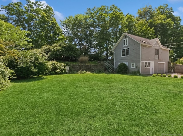 8 Washington Ave, Westport, CT 06880 - view of grassy yard with an attached garage and stairs