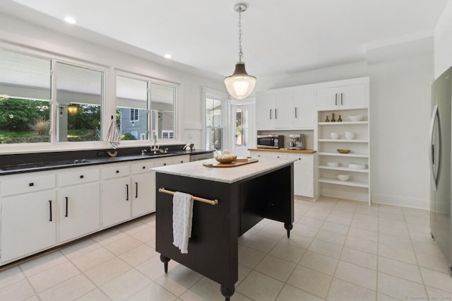8 Washington Ave, Westport, CT 06880 - kitchen featuring appliances with stainless steel finishes, open shelves, a sink, light tile patterned flooring, and healthy amount of natural light