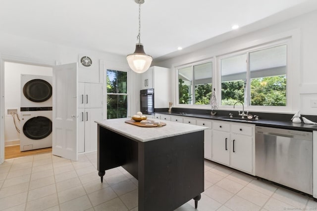 8 Washington Ave, Westport, CT 06880 - kitchen featuring dishwasher, estacked washer and dryer, black oven, a sink, and white cabinets