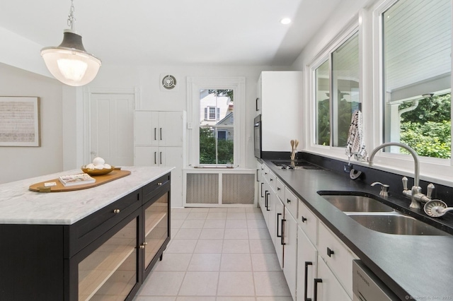 8 Washington Ave, Westport, CT 06880 - kitchen with plenty of natural light, a sink, and white cabinetry