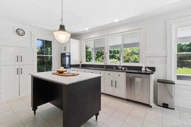 8 Washington Ave, Westport, CT 06880 - kitchen with stainless steel dishwasher, a sink, white cabinetry, decorative light fixtures, and a center island