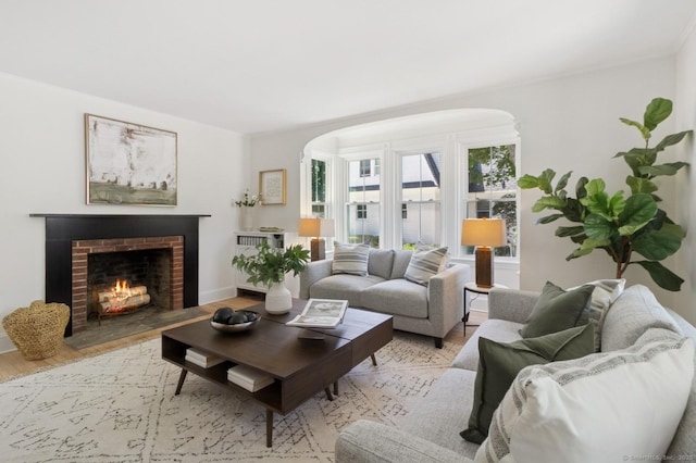 8 Washington Ave, Westport, CT 06880 - living area with light wood finished floors, arched walkways, and a fireplace