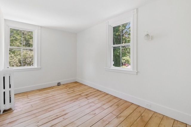 8 Washington Ave, Westport, CT 06880 - spare room with wood-type flooring, plenty of natural light, and baseboards