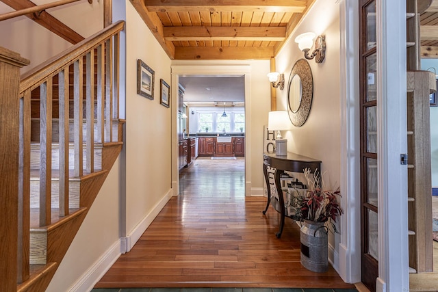 61 Baldwin Brook Rd, Canterbury, CT 06331 - hall featuring wooden ceiling with exposed beams, wood-type flooring, a sink, and baseboards