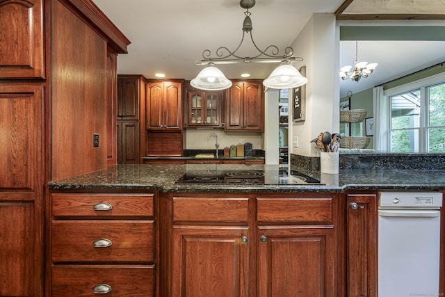 61 Baldwin Brook Rd, Canterbury, CT 06331 - kitchen with black electric stovetop, glass insert cabinets, a chandelier, dark stone counters, and decorative light fixtures