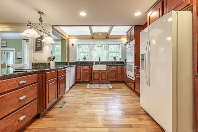 61 Baldwin Brook Rd, Canterbury, CT 06331 - kitchen featuring white appliances, light wood-type flooring, healthy amount of natural light, a sink, and beam ceiling