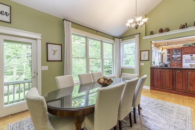 61 Baldwin Brook Rd, Canterbury, CT 06331 - dining room featuring a chandelier, light wood-type flooring, and vaulted ceiling