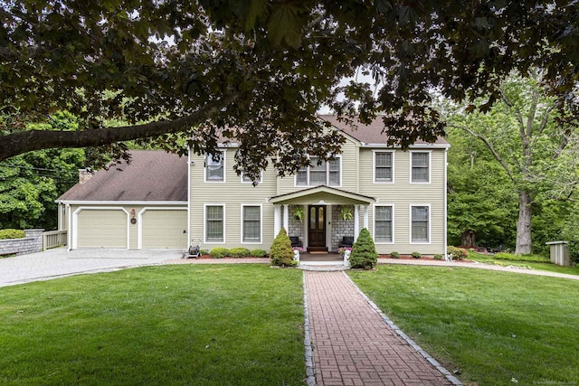 61 Baldwin Brook Rd, Canterbury, CT 06331 - colonial inspired home with an attached garage, a porch, a front yard, and driveway