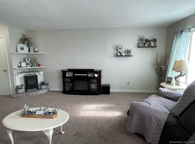 9 Staffordshire Commons Dr Unit 9, Wallingford, CT 06492 - carpeted living area featuring a brick fireplace and a textured ceiling