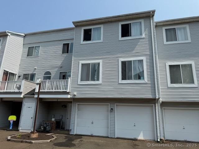 9 Staffordshire Commons Dr Unit 9, Wallingford, CT 06492 - back of house with an attached garage