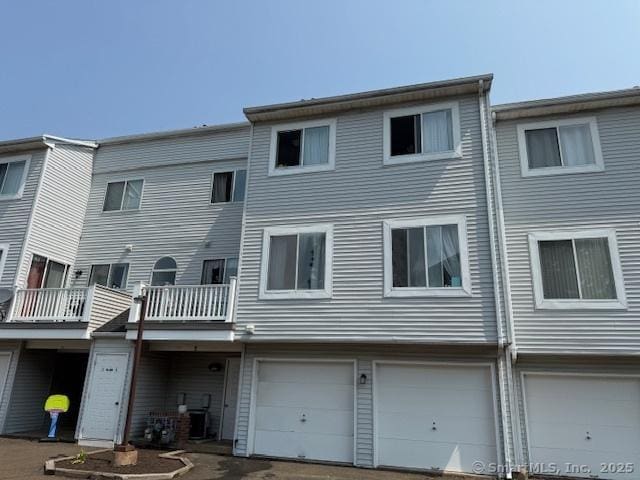9 Staffordshire Commons Dr Unit 9, Wallingford, CT 06492 - rear view of property with an attached garage