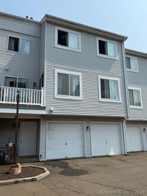 9 Staffordshire Commons Dr Unit 9, Wallingford, CT 06492 - rear view of property with a garage