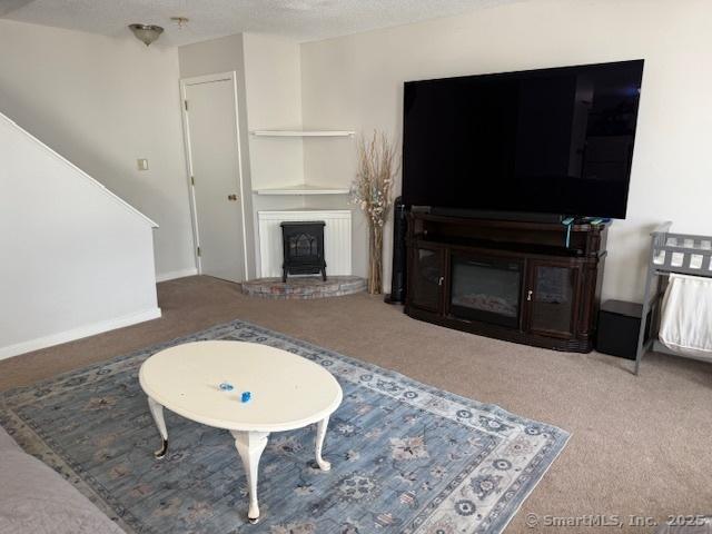 9 Staffordshire Commons Dr Unit 9, Wallingford, CT 06492 - living room with carpet flooring and a fireplace