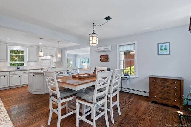 3 Colonial Dr, Clinton, CT 06413 - dining room with baseboard heating, a wall mounted air conditioner, dark wood-type flooring, and healthy amount of natural light